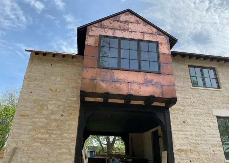 Copper metal panel facade on a stone building for Metal Roof Coating in Loudoun Valley Estates